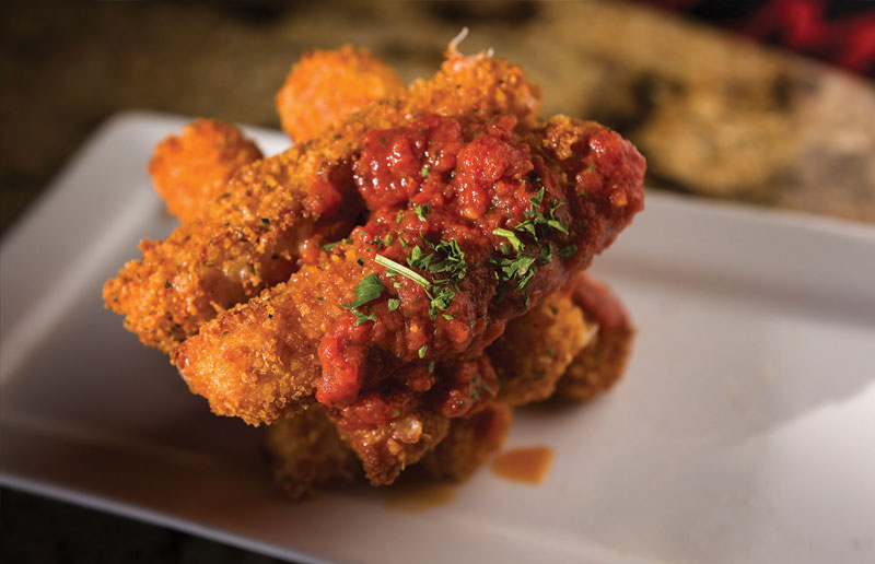 Fried mozzarella sticks are lightly breaded and served with original Ruckus marinara.