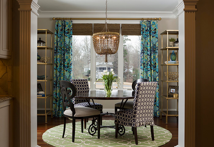While the home’s kitchen features a neutral color scheme, the adjoining breakfast room allows Cooling to share her love of color and pattern. In for 2017, note local designers Vicky Serany and Lauren Burns, are warm metals and jewel tones. Pillows and paint can offer the biggest bang for your buck, Burns says, as an easy, inexpensive way to add fresh colors and patterns.