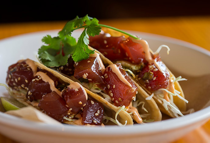 The marinated yellowfin tuna poke taco with avocado and sesame Sriracha mayo