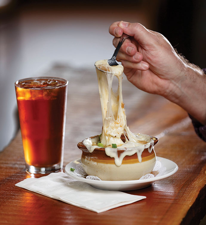 Cheesy baked French onion soup at the Crosstown Pub & Grill is a popular menu item.