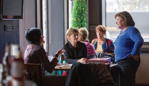 Crosstown owner Sheila Ryan chats with customers at the Crosstown Pub.