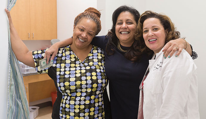 Medical assistant Tawana Daniel, left, receptionist Days Nunez, center, and family nurse practitioner Datanya Betts.