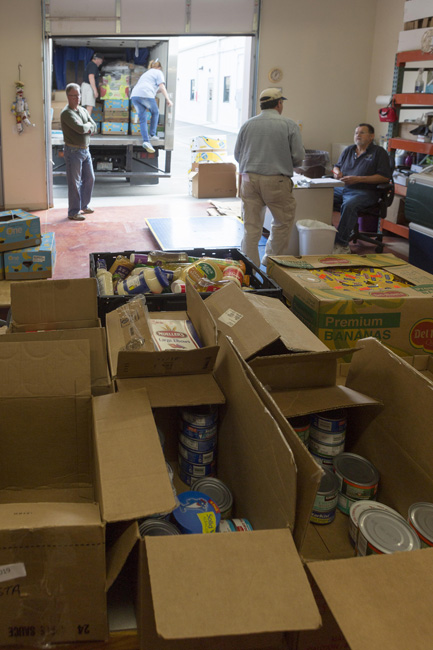 A truckload of donated food awaits volunteers who will stock shelves, refrigerators and freezers.