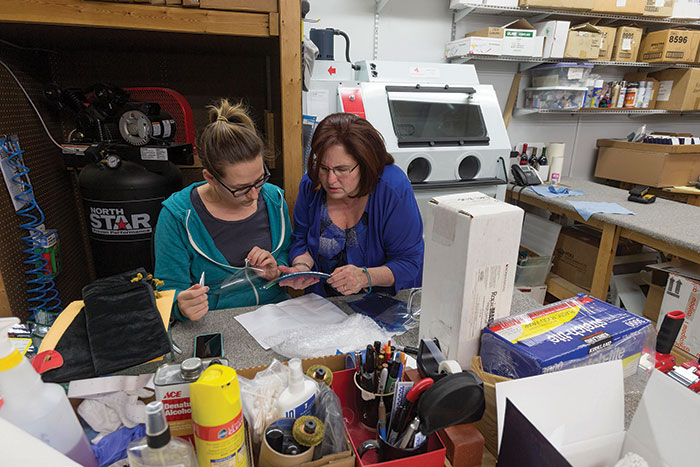 Lisa Higginbotham, right, with production associate Amanda Jackson, moved to North Carolina straight from the beaches of Puerto Rico, and is now the award-winning owner of 5Star Awards in Cary and an active Rotary member, part of raising funds for local charitable organizations. “It’s important to give back to the community,” she says. 