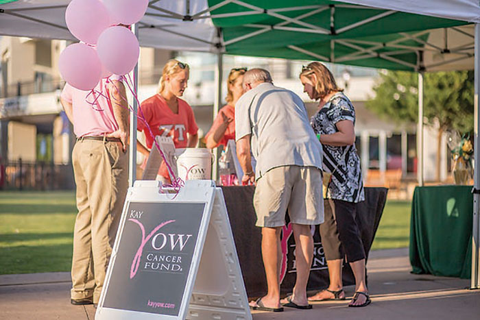 Participants in the Waverly Place Wine Walks, right, are eligible for prizes, and their donations benefit the Kay Yow Cancer Fund. 