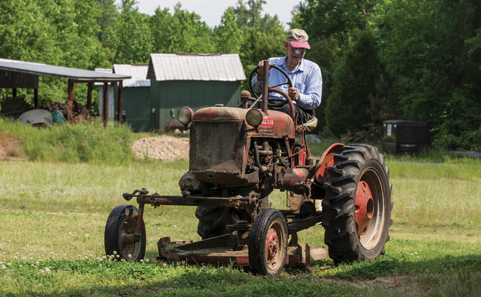 Billy Upchurch mows his grass with a McCormick Farmall Cub, still running fine after more than 60 years. “We never throw anything away. Every resource, every piece of farm equipment can be repaired and used again,” says his son, William Upchurch.