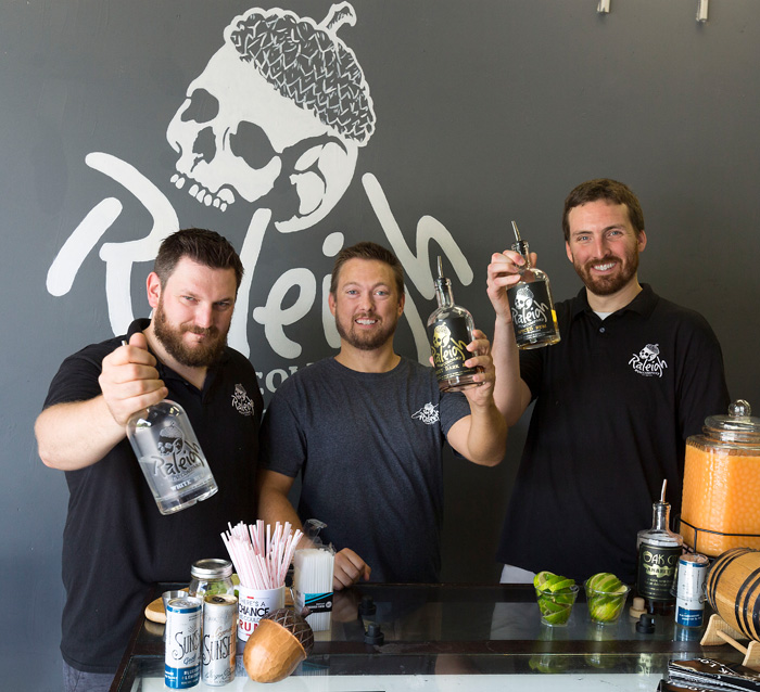 John Benefiel, from left, Chris Mendler and Matt Grossman had wanted to open a brewery, but by the time they were able to act on that dream, the Triangle already had plenty of breweries. “We were still interested in doing something, and one of us brought up distilling,” says Benefiel. “Chris said, ‘I’d love to make rum.’ In the next 30 seconds Matt said, ‘We should call it Raleigh Rum Company.’ We just decided to do it.”