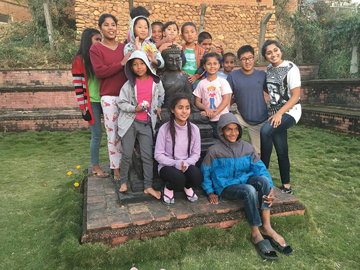 Reese Geyer and Riya Thomas, right, brought supplies to a home for abanboned children about an hour outside Kathmandu. Mostly girls live at the orphanage, and the education they receive helps them to be self-sufficient. 