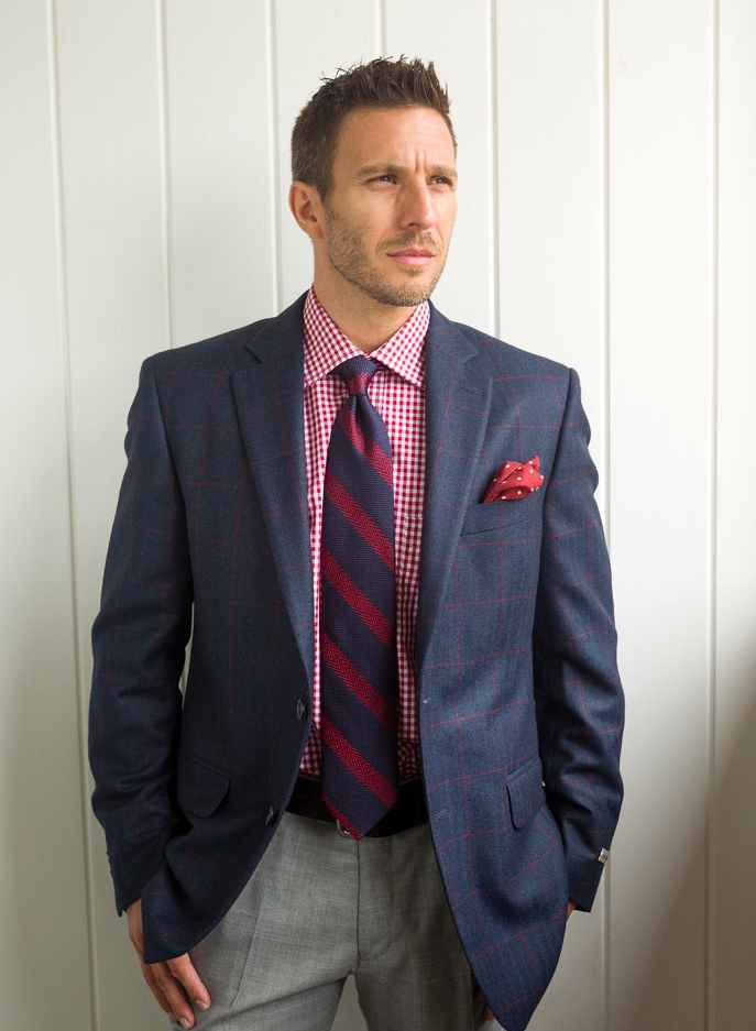 Red and white gingham shirt, $155; Pants, $175; Tie, $115; Polka dot pocket square, $59.50; Blue jacket with red windowpane, $795; From Ashworth’s Clothing