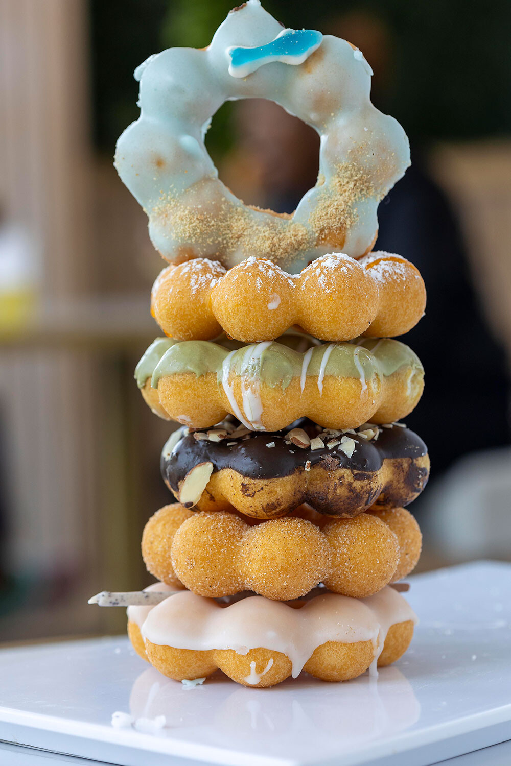 Mochi donuts have a unique shape with eight dough balls, perfect for breaking apart and sharing.